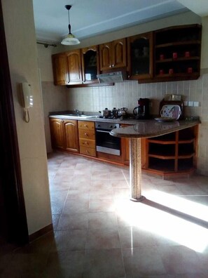 Apartment, 2 Bedrooms | Private kitchen | Fridge, microwave, oven, stovetop