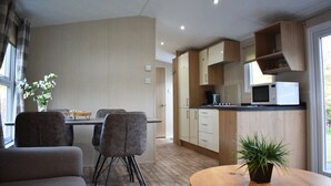 Chalet, 2 Bedrooms | Living area - VDB Holiday - Recreatiepark de Voorst (Kraggenburg)
