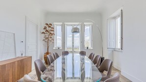 A conference room with a glass table, chairs, a wooden cabinet, and a large window with a view. - Snowshoe (Ragalna)