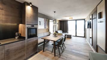 Luxury Apartment | Living area | Flat-screen TV, heated floors