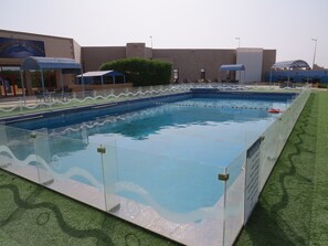 Outdoor pool, open 7:00 AM to 5:00 PM, free cabanas, pool umbrellas