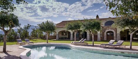 Seasonal outdoor pool, pool loungers