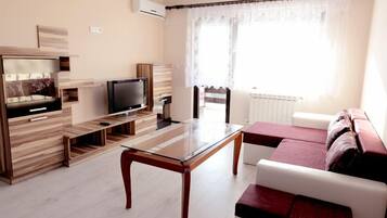 Luxury Apartment, 1 Bedroom | Living area | Flat-screen TV