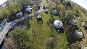 A large, open area with yurts and a central pathway.