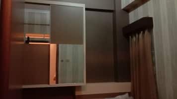 Family Room | Desk, iron/ironing board, bed sheets