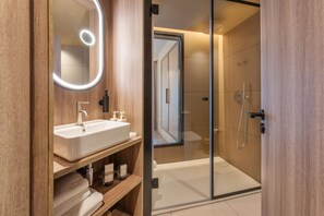 Designer toiletries, hair dryer, bathrobes, slippers