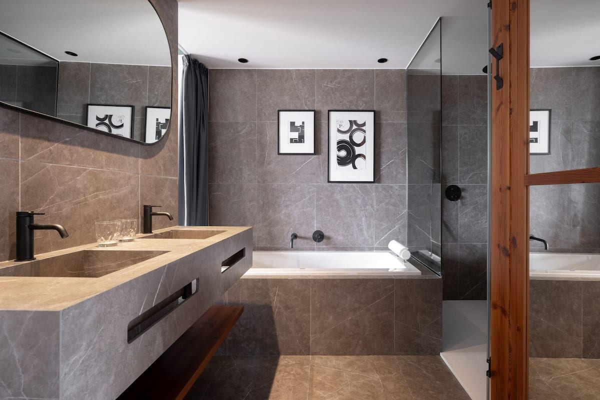 designer toiletries, hair dryer, bathrobes, slippers