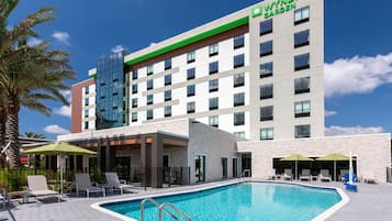 Outdoor pool, open 7:00 AM to 10:00 PM, pool umbrellas, sun loungers