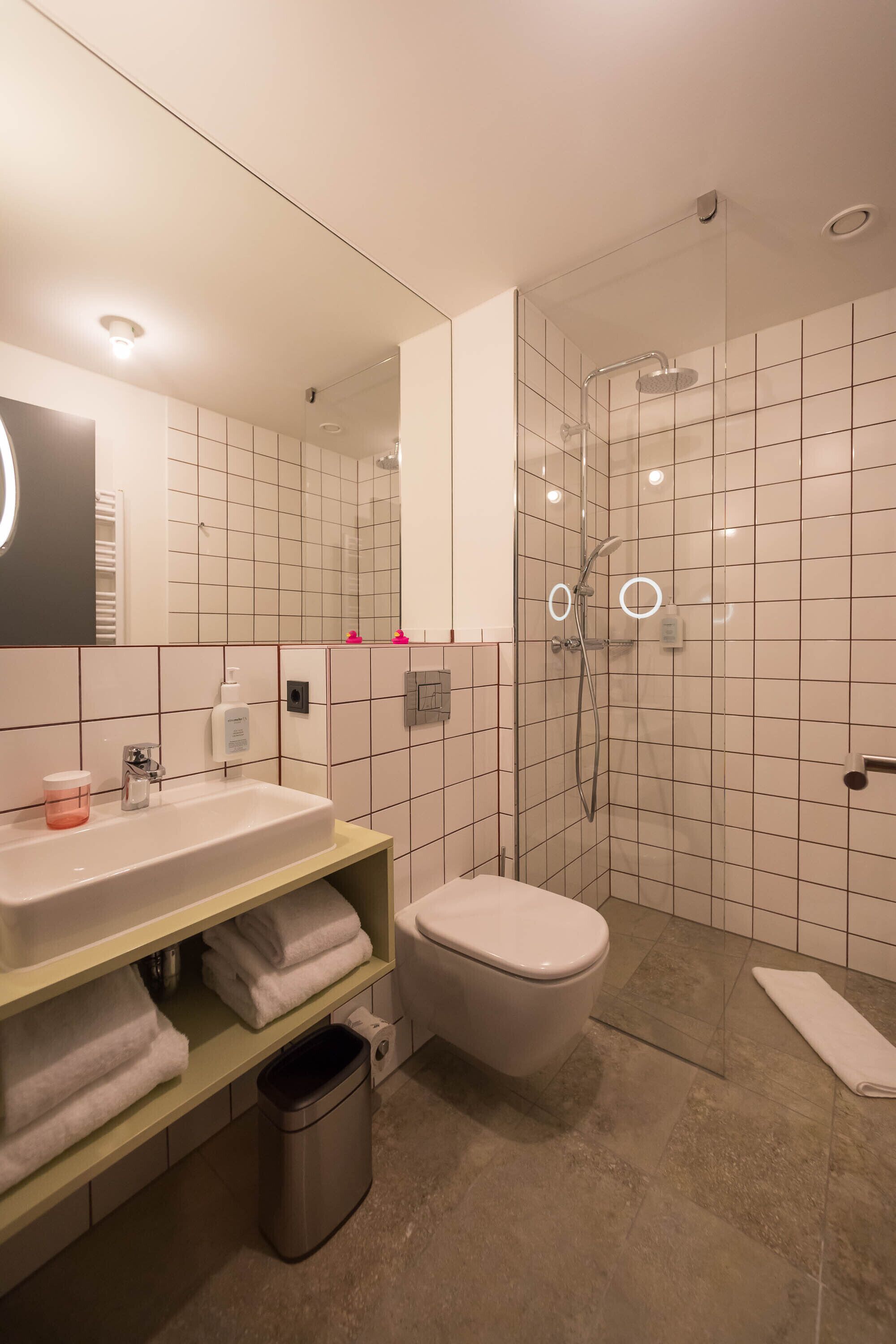 shower, eco-friendly toiletries, hair dryer, towels