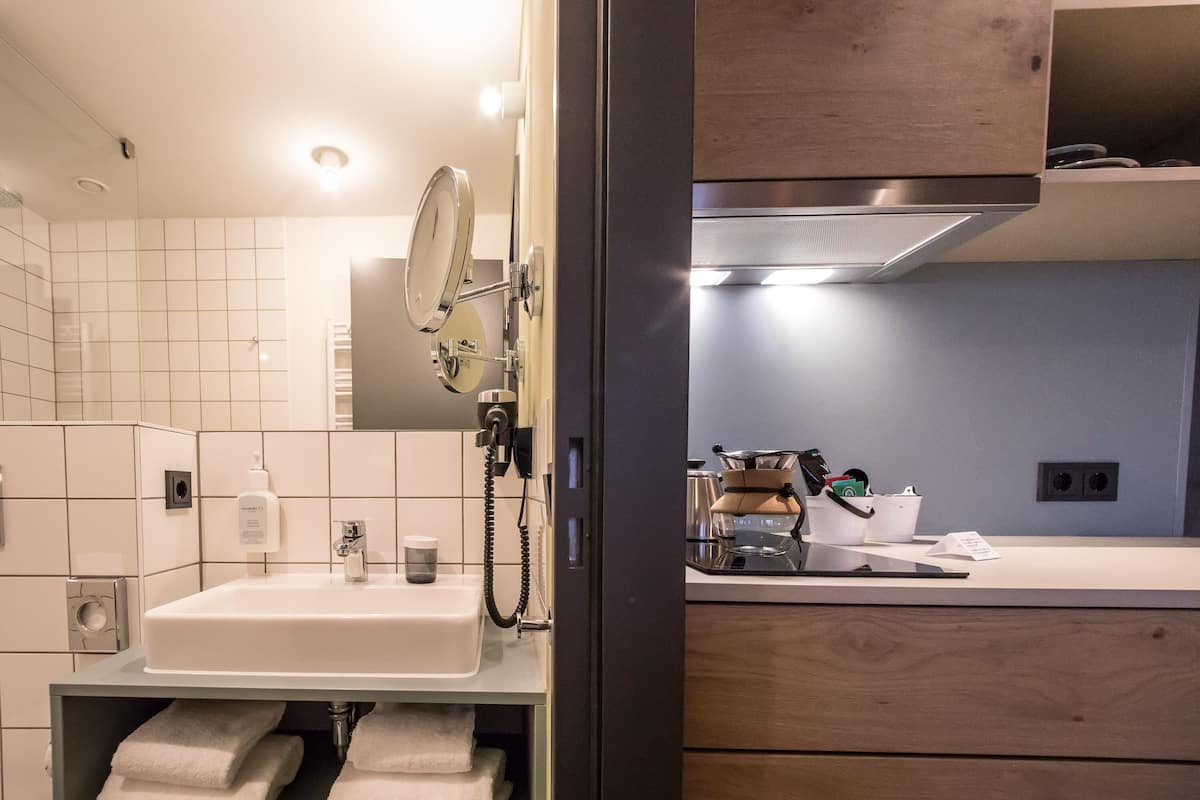 shower, eco-friendly toiletries, hair dryer, towels