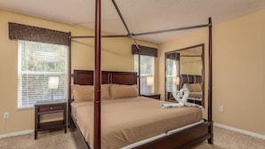 A four-poster bed in a room with beige walls and carpet. - Terra Verde-ru1056 (Kissimmee)