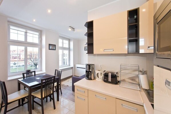 Apartment | Private kitchenette | Full-sized fridge, microwave, stovetop, dishwasher