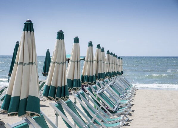 Private beach, white sand, sun-loungers, beach umbrellas