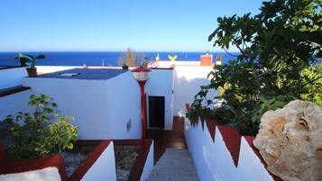 Enjoy breathtaking sea views from this rooftop terrace with a Mediterranean flair.