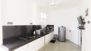 Full-size fridge, microwave, paper towels