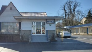 A small, single-story building with a sign reading "Blue Haven Motel Office". - Blue Haven Motel I-75 North Exit 128&129 (Rocky Top)