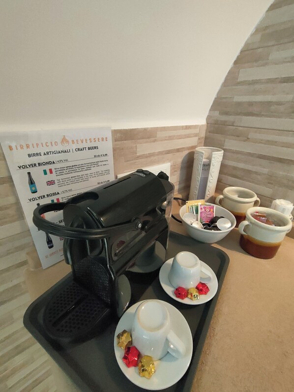 A coffee machine, cups, and a tray with food items in a hotel setting. - Trullo alleyway, central with private garden (Alberobello)