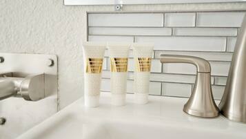 Designer toiletries, hair dryer, towels