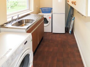 A laundry room with a washing machine, dryer, and a sink. - What more could you ask for than a spacious family home in a rural haven. (Yanwath, near Penrith)