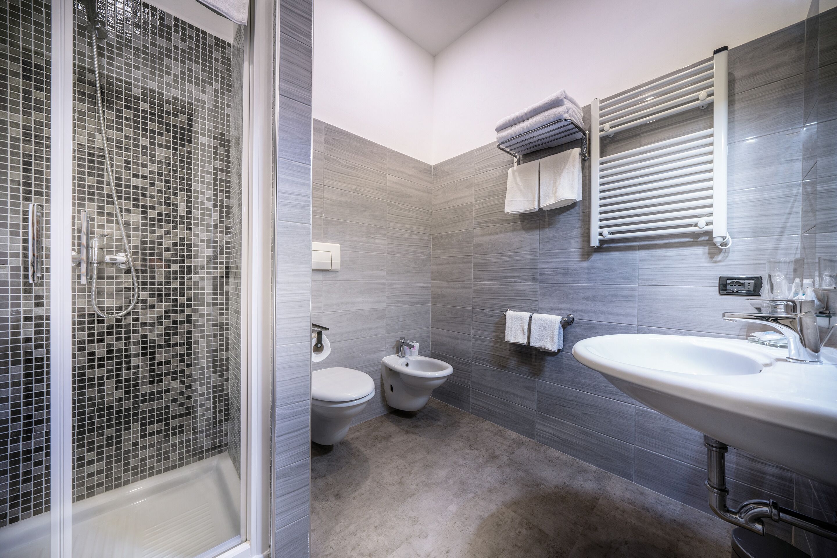 deluxe triple room | bathroom | rainfall showerhead, free toiletries, hair dryer, bidet