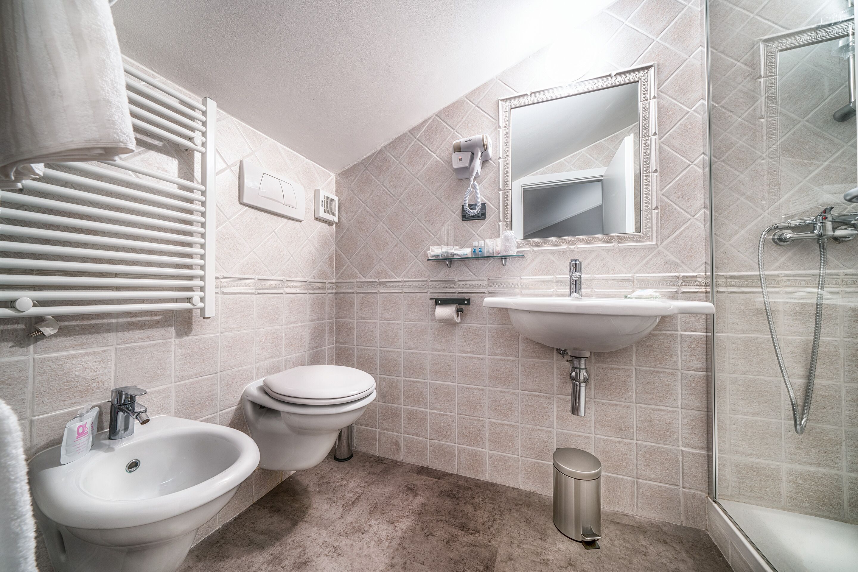 junior triple room | bathroom | rainfall showerhead, free toiletries, hair dryer, bidet