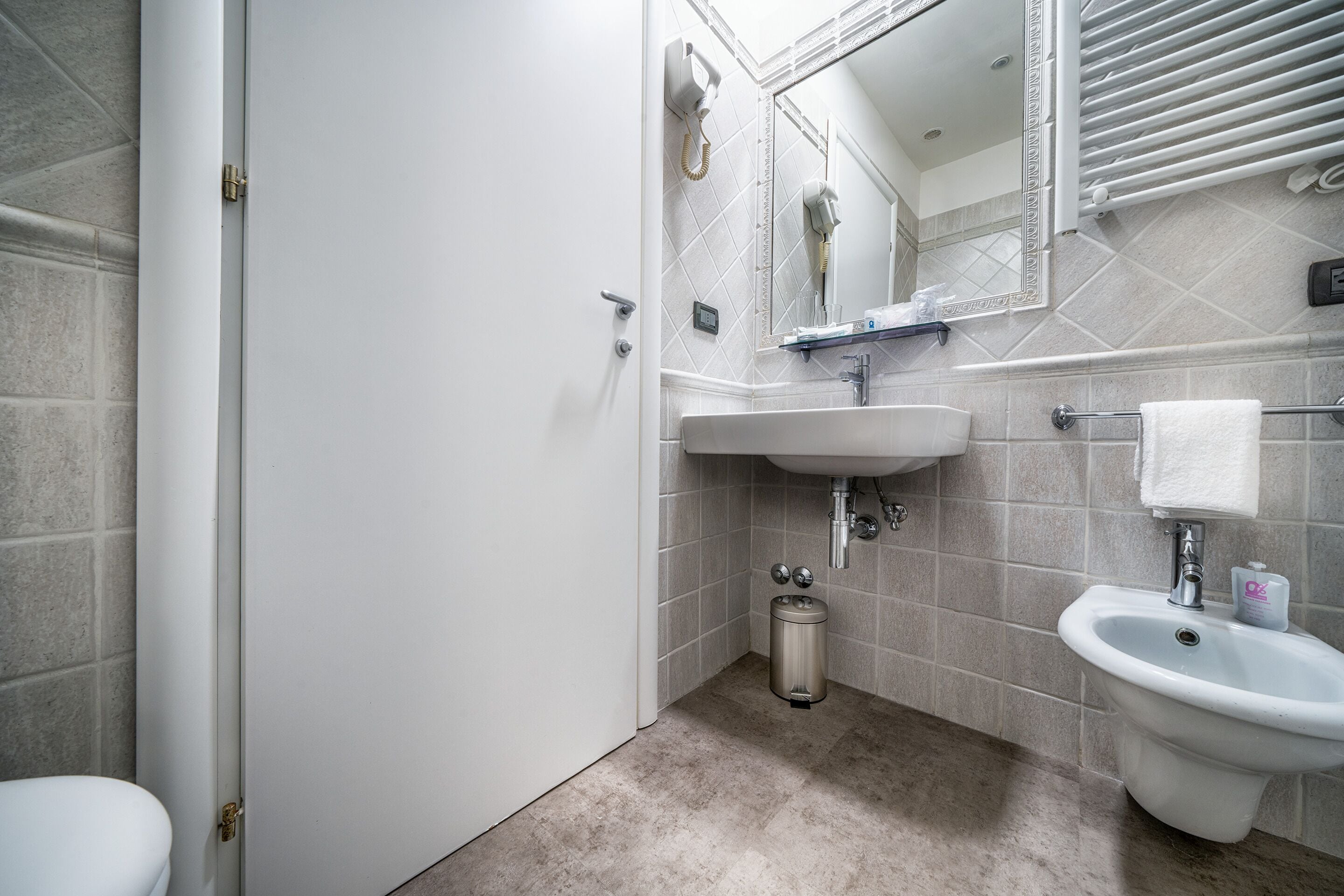 classic double room | bathroom | rainfall showerhead, free toiletries, hair dryer, bidet