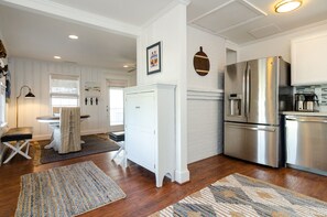 Enjoy cooking in this well-equipped kitchen with a refrigerator, oven, and ample cabinetry.