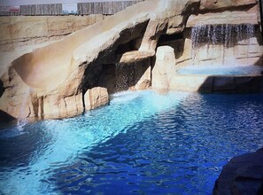 A pool with clear blue water and rocky formations. - 2.7MI DISNEY//CONVENTION CENTER GETAWAY (Anaheim)