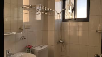 Shower, eco-friendly toiletries, hair dryer, slippers
