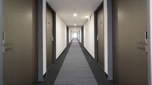 A long, narrow hotel corridor with doors on both sides, each marked with a number. -  Washington R&B Hotel Sendai Higashiguchi (Sendai)