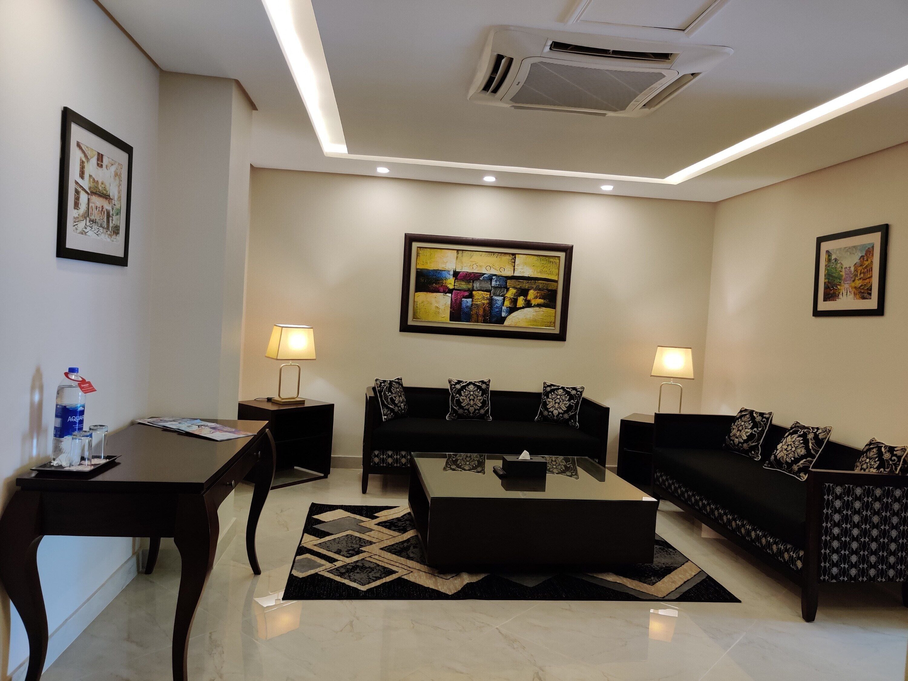 royal suite, multiple beds, smoking | living area | flat-screen tv, heated floors