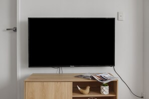 Apartment, 1 Bedroom, Non Smoking, Kitchen | Living area | 49-inch LCD TV with cable channels, TV - Heart of Ormond Apartment  by Ready Set Host (Ormond)