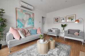 Apartment, 1 Bedroom, Non Smoking, Kitchen | Living area | 49-inch LCD TV with cable channels, TV - Heart of Ormond Apartment  by Ready Set Host (Ormond)