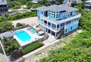 A multi-story house with a pool, outdoor seating, and a deck. - Semi-Oceanfront, ELEV, Ocean views, Private Pool, OS5C, Belle Atlantic (Corolla)