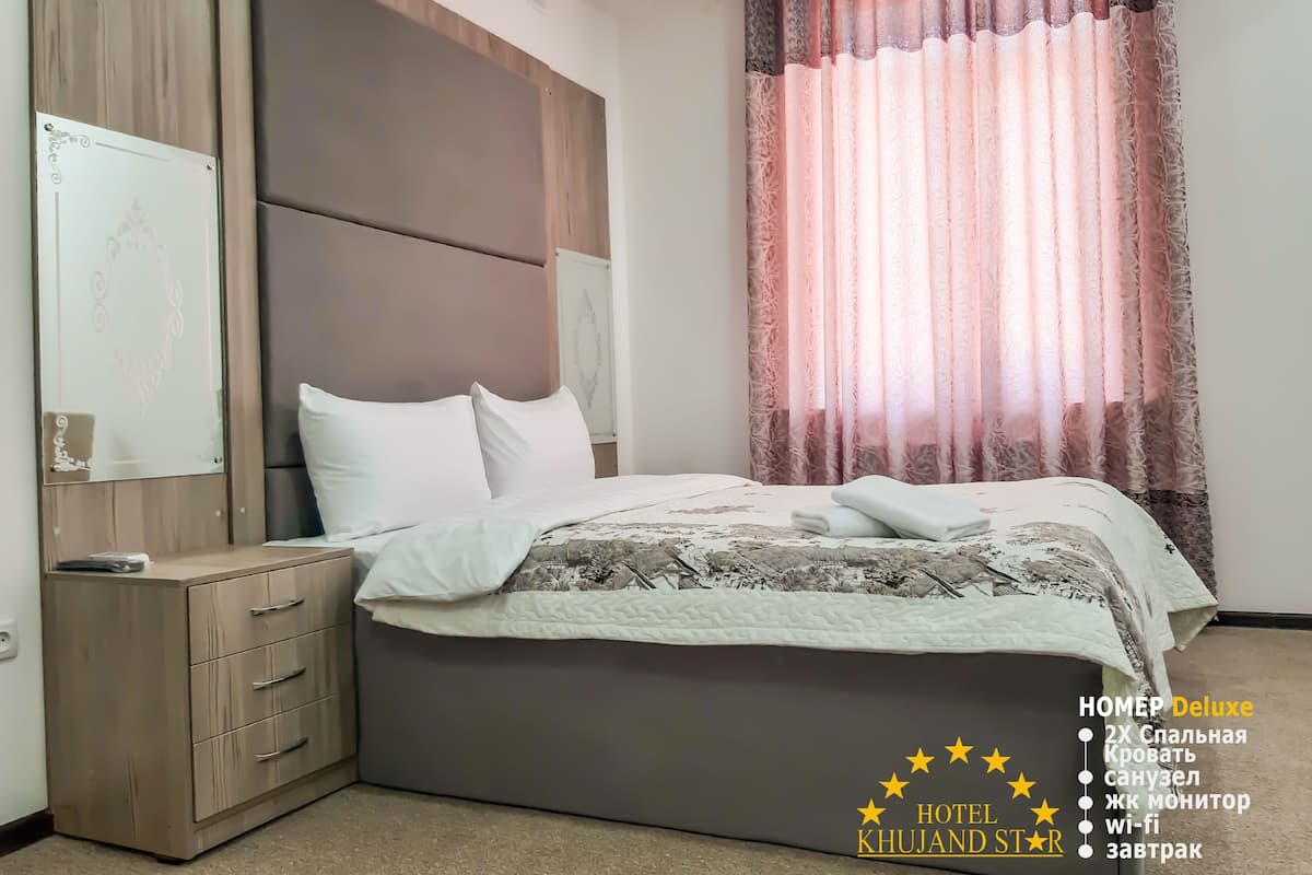 Habitación Deluxe doble | Cortinas opacas y sistema de insonorización