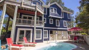 A two-story house with a swimming pool, outdoor seating, and a wooden deck. - Semi-Soundfront, Private Pool, Hot Tub, Community Amenities, 507, N-2-Wishn (Corolla)