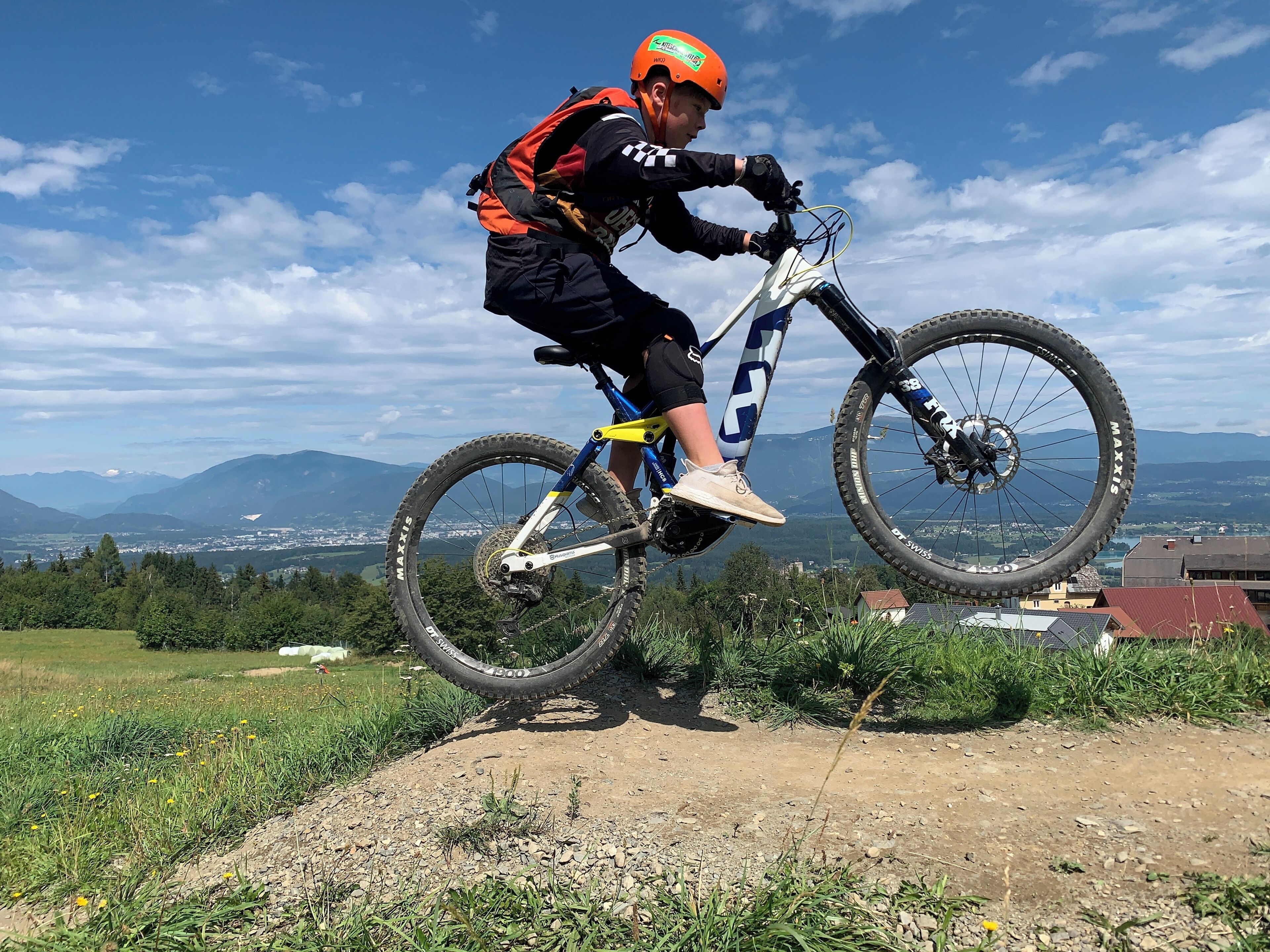 A person on a mountain bike performing a jump.