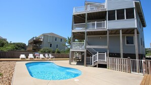 A multi-story building with a pool and outdoor seating. - Oceanside, Private Pool, Screened Porch, Close to Beach Access, OS3H, Brigadune (Corolla)