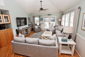 Flat-screen TV, DVD player, foosball, books