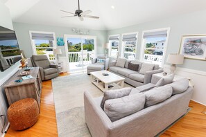 Flat-screen TV, DVD player, table football, books