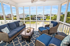 Flat-screen TV, DVD player, table football, books