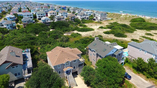 A coastal residential area with houses, a beach, and a clear view of the ocean. - Oceanside, Hot Tub, Screened porch, Close to Beach, OS9H, Starfisher (Corolla)