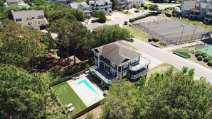 A two-story house with a large deck and a swimming pool. - Oceanside, Comm Amenities, Priv Pool, Close to Beach, Rec Rm, 219, Turtle Cove (Corolla)