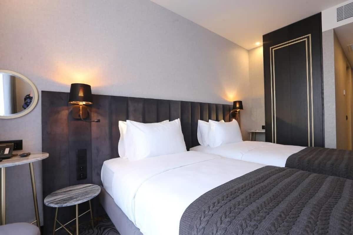 Economy kamer, 1 twee- of 2 eenpersoonsbedden | Een kluis op de kamer, geluiddichte muren, gratis wifi, beddengoed