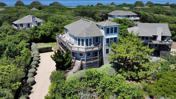A coastal property with multiple houses surrounded by dense greenery and a clear view of the ocean. - Oceanside, Screened Porch, 100 ft to Beach Access, SA180, Siren Song (Duck)