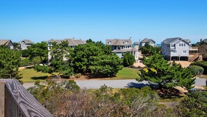 A residential neighborhood with houses, lawns, and trees. - Oceanside, Screened Porch, 100 ft to Beach Access, SA180, Siren Song (Duck)