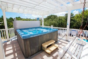 A hot tub under a white pergola with a wooden bench and a pool in the background. - Oceanside, Private Pool, Hot Tub, Close to beach access, 224, Its All Good (Corolla)