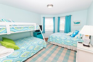 A room with bunk beds, a desk, a lamp, and a window with curtains. - Oceanside, Private Pool, Hot Tub, Close to beach access, 224, Its All Good (Corolla)