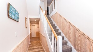 A staircase with wooden railings and carpeted steps leading to an upper floor. - Oceanside, close to beach, Community Pools, Community Tennis, 643, Ocean Dream (Corolla)