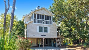 A two-story house with a balcony, a porch, and a driveway. - Semi-Soundfront, Rec Room, Community Amenities, 533,Sound Secret (Corolla)